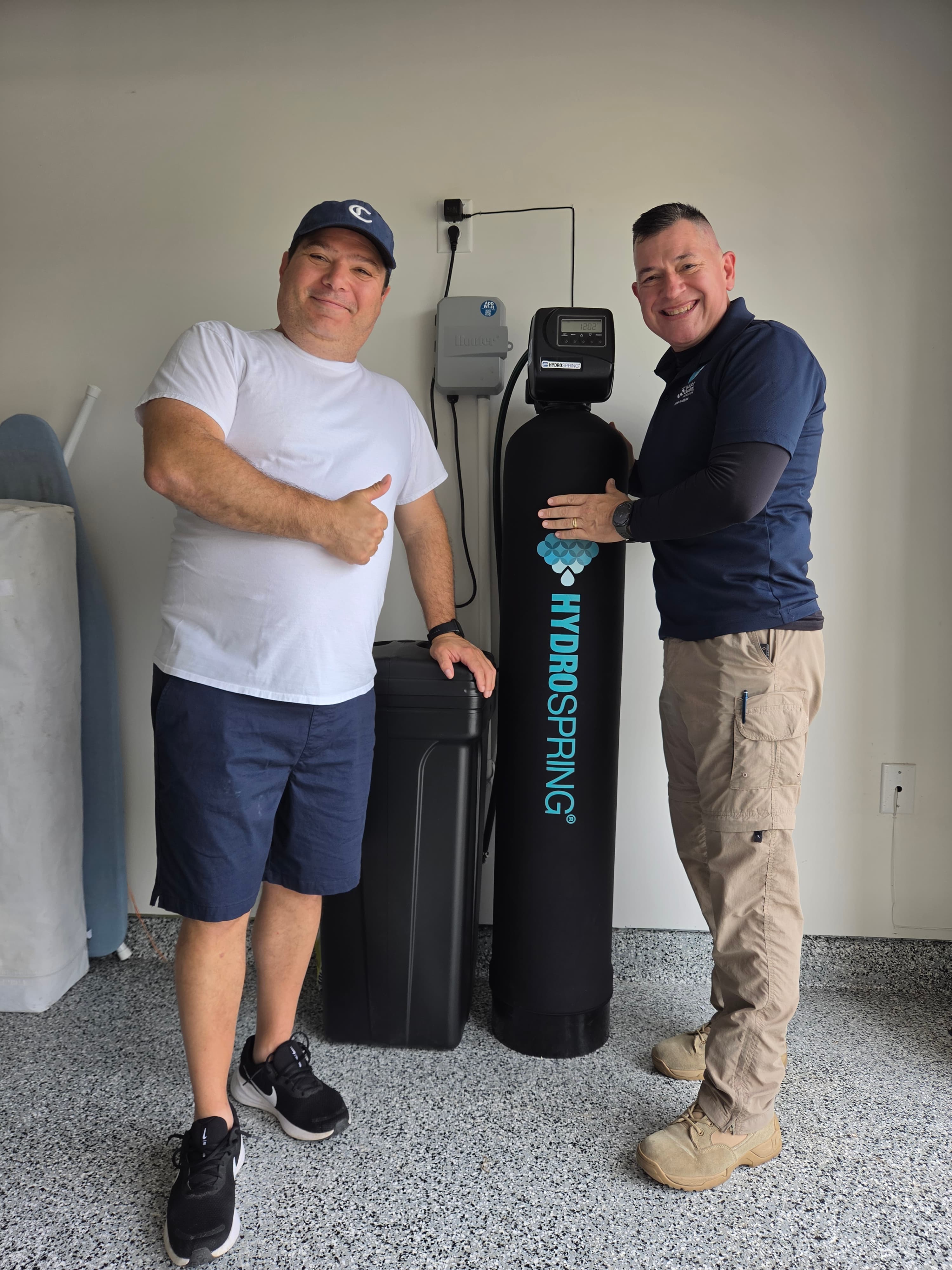 Homeowner with newly installed water softener system