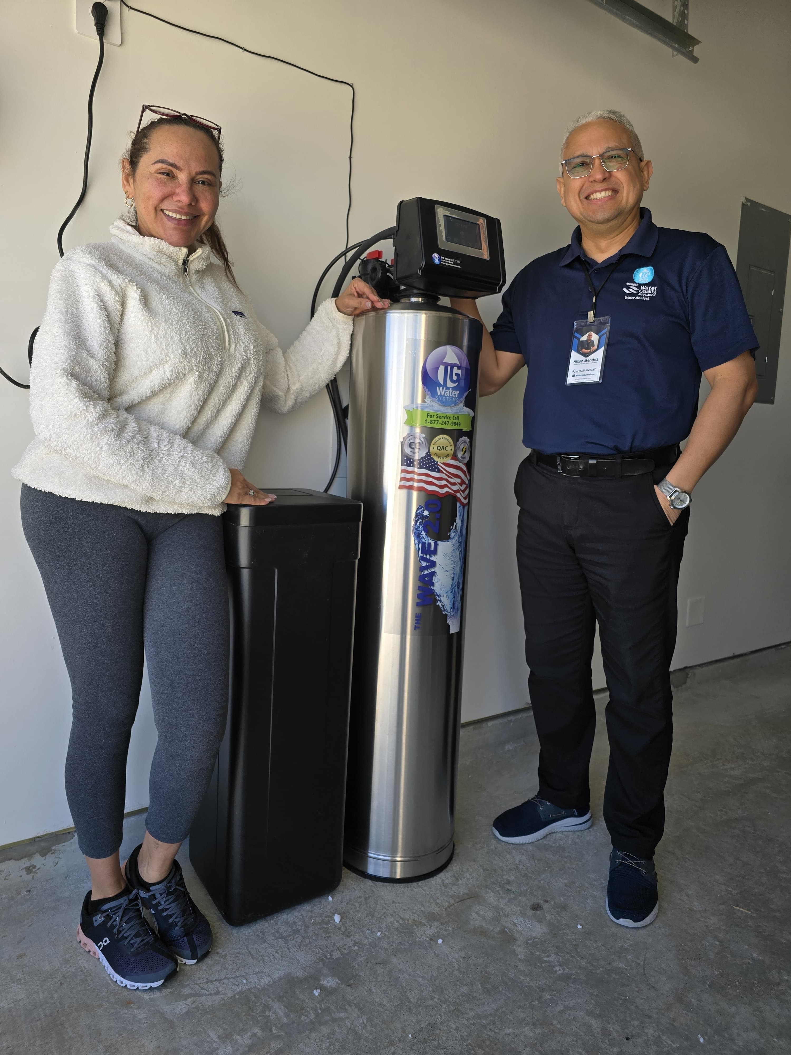 Customers next to whole-home water purification system