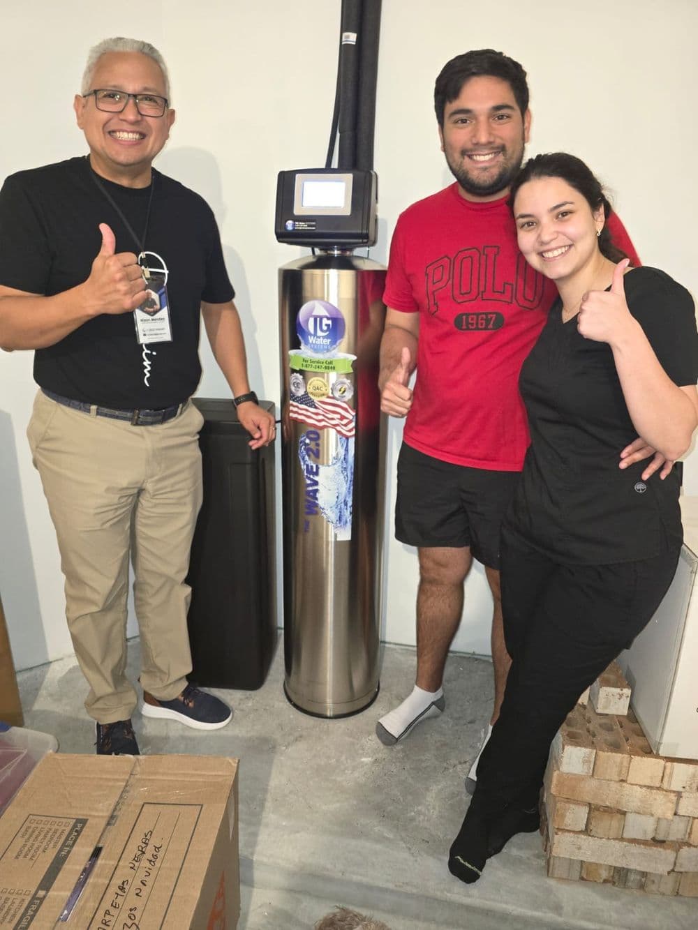 Happy family with their new water purification system